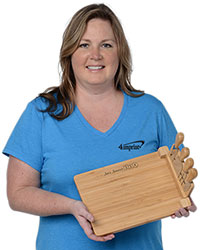 Laurie holding the 5 Piece Magnetic Bamboo Cheese Board Set