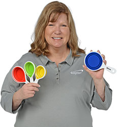 Paula holding the Pop Out Silicone Measuring Cups